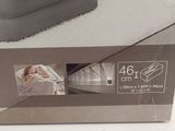 packaging of the inflatable air mattress in a box on the floor