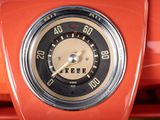 a close up of a speedometer on an orange car