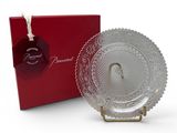 an image of a glass plate sitting next to a red box