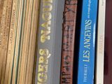 many books that are sitting on a shelf together