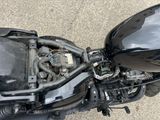 a black motorcycle with a black engine and a black seat