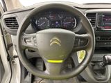 the interior of a car with a steering wheel and dashboard controls