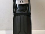 a close up of a black and gray water bottle on a table