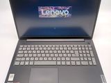 the laptop is open on a white surface with a logo on the screen