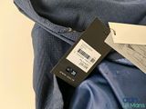 a label on the back of a jacket that is attached to the back of a jacket