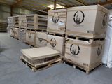 many boxes and pallets stacked on pallets in a warehouse