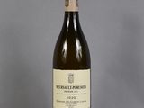 a bottle of wine that is sitting on a table