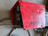 a picture of a red and black welding machine and some wires