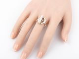 an image of a woman ' s hand with a ring on it ' s finger
