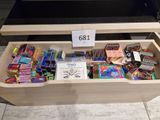 a wooden box filled with assorted cards and games