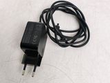 an image of a black charger and cord on a white surface