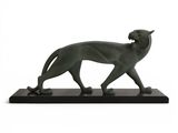 an image of a statue of a cat on a black base