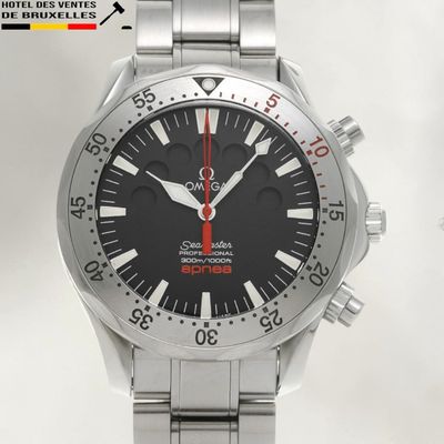 an image of a watch with a black face and red hands