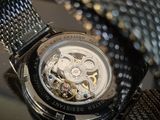a close up of a watch on a table