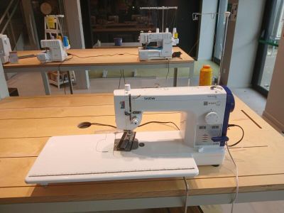 a sewing machine sitting on a table in a room