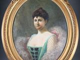 portrait of a woman in a green dress in a gold frame