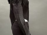 an image of a mannequin wearing a black top and black pants