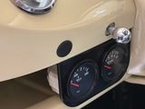 a close up of a car dashboard with a speedometer and gauges