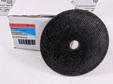 several rolls of black cloth are stacked on top of each other