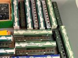 a lot of toy trains that are sitting on a table