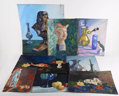 many paintings that are on display on the table
