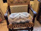 a chair that is sitting in front of a window