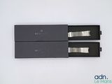 the two black boxes are open on a white surface
