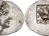 a silver coin with an image of a woman on it