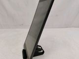 a tablet that is sitting on a stand on a table