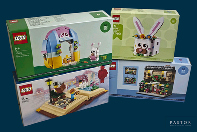 trois boîtes de Lego posées sur une table