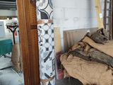 an image of a room with a bed and a mirror