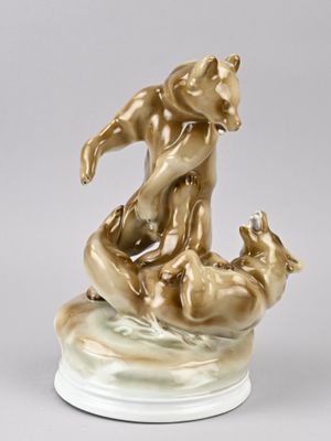 statue of a man and a dog on a marble base