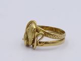 an image of a gold ring with an elephant ' s head on it