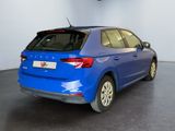 the rear end of a blue car in a showroom