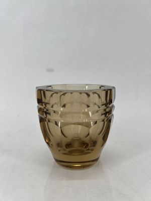 an image of a brown glass cup sitting on a white surface