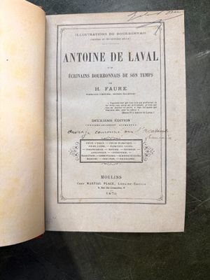 an open book on a table with a black table cloth