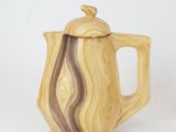 an image of a wooden coffee pot with a lid on a white background