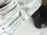 a glass jar with a liquid inside of it on a table