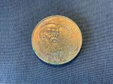 a close up of a coin with a beard on it