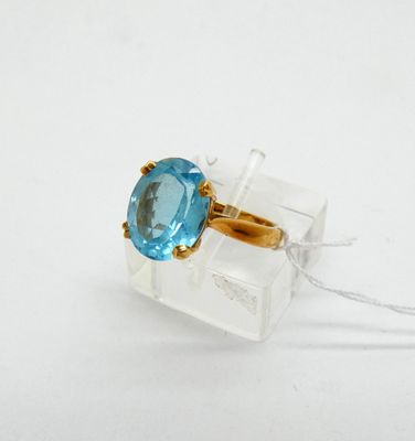 a ring with a blue topaz stone in it