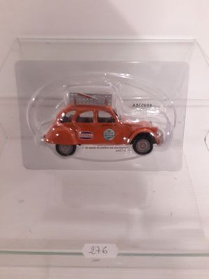 a small toy car in a clear display case