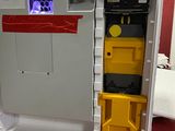 a white refrigerator with a yellow door and a black and red door