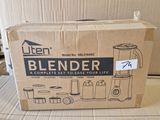 cardboard box sitting on top of a cardboard table with a blender in it