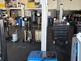 an image of a workshop area with a work bench and equipment