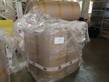 many rolls of paper wrapped in plastic on a pallet