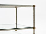 an image of a glass and brass coffee table on a white background