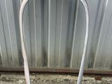 a metal frame that is leaning up against a wall