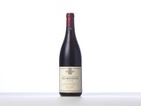 a bottle of red wine sitting on top of a table