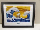 framed picture of a painting of a boat in a wave