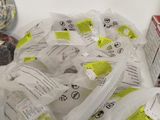 many bags of yarn and a ball of thread on the table